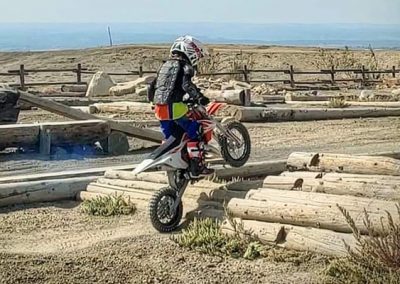 Small kid on a dirtbike at Peach Valley on a KTM