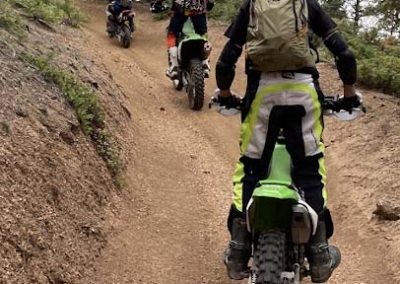 Image of 3 motorcycle off road riders training along a trail.