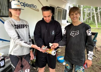 Dirtbiking kids on summer break pick up trash.