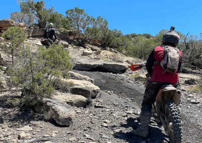 Riders wait for eachother on switchbacks of Sidewinder Trail